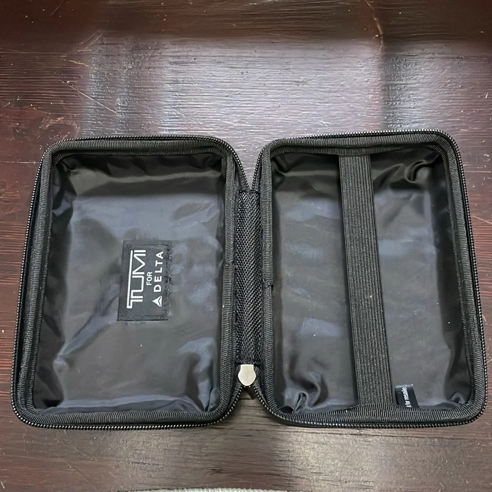 TUMI Silver Travel Size Hard Shell Case With Sturdy Black Zipper & Inner Elastic